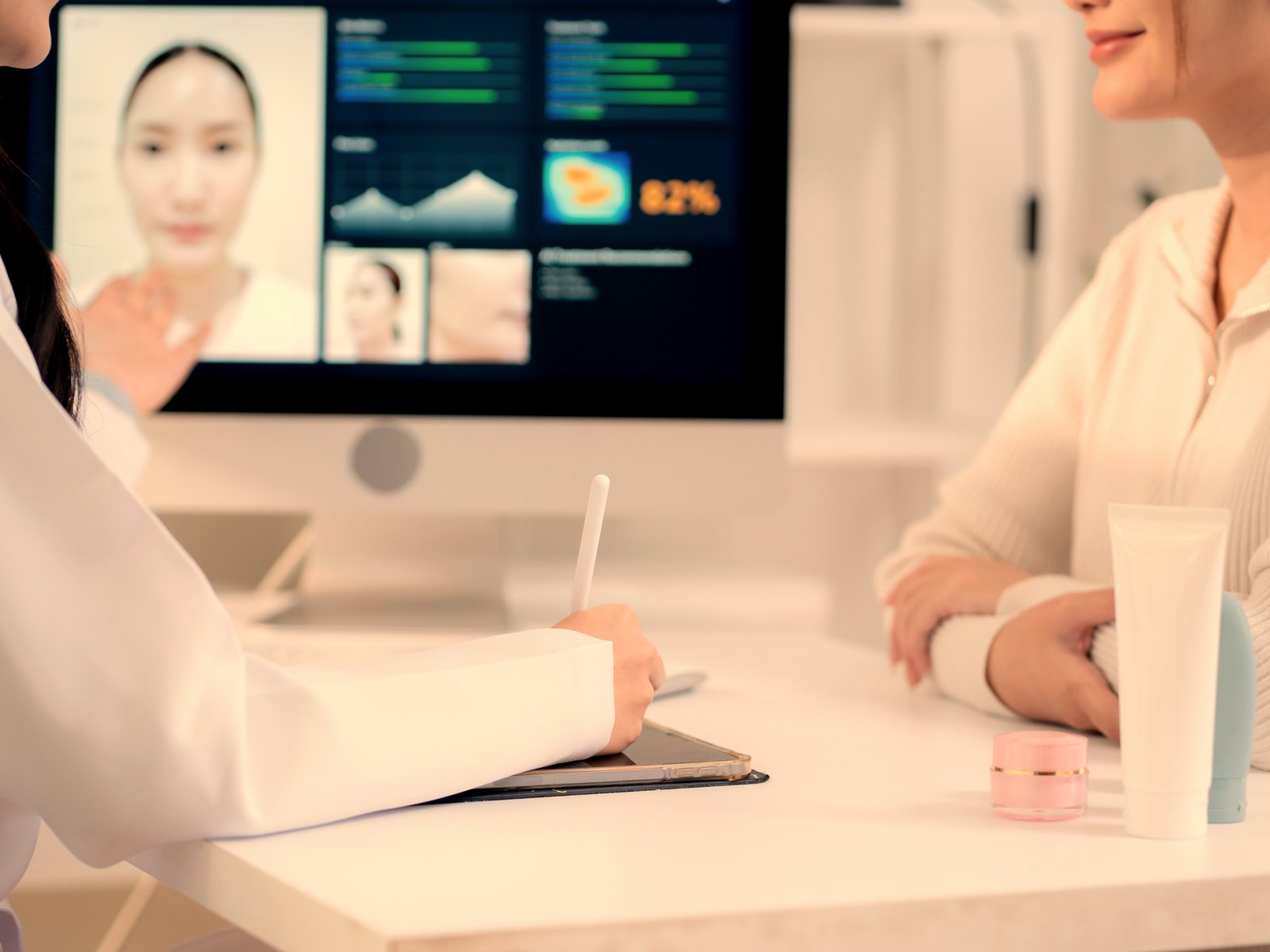 Clinician reviewing a client's skin analysis results on a tablet