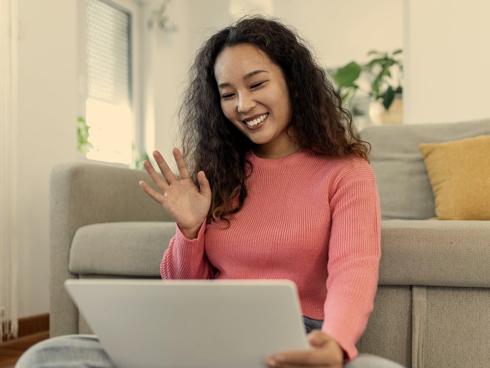 Young adult participating in a virtual wellness follow-up.